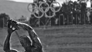 Discus Thrower with Olympic Rings in the Background