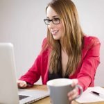 A young lady working on a laptop